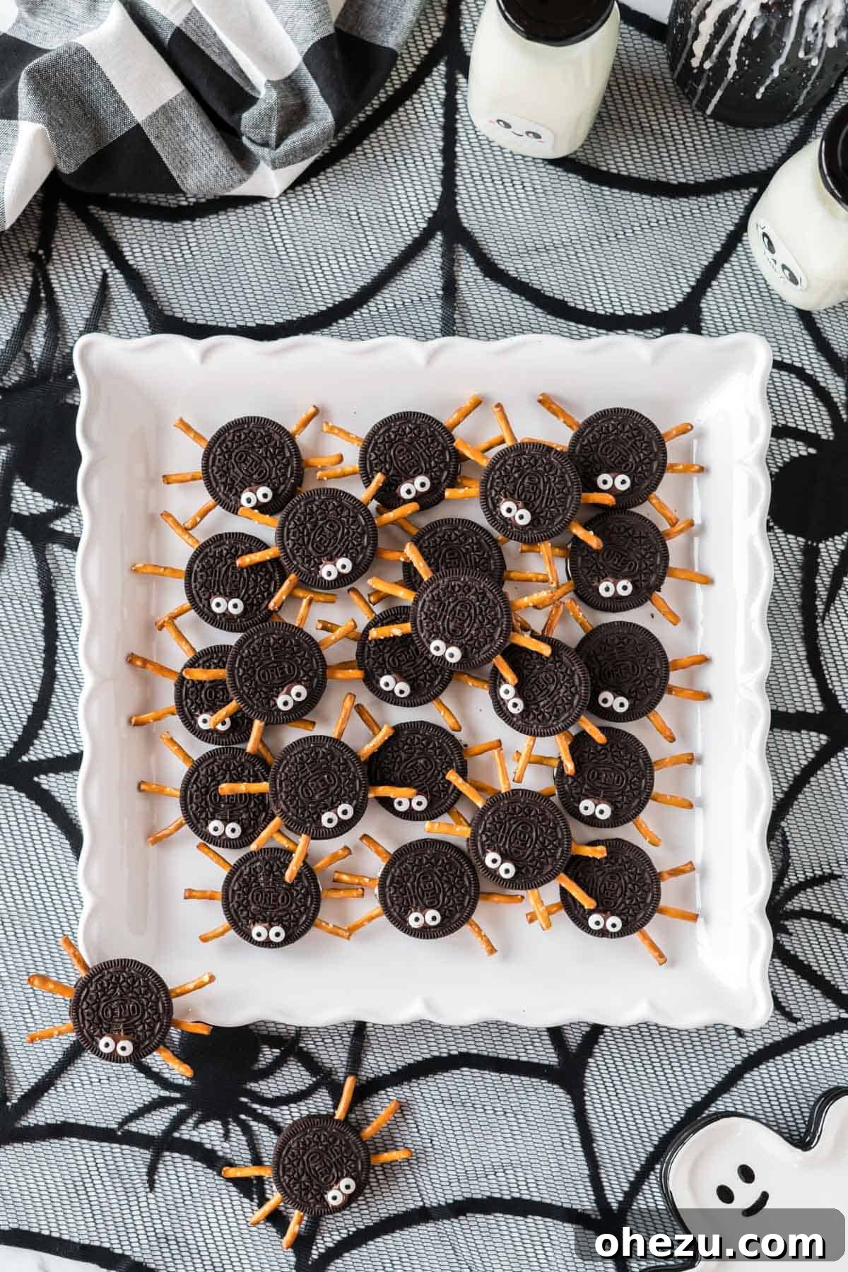 Spooky Oreo Spiders 13 Oreo spider cookies neatly arranged on a white serving tray