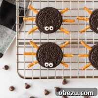 Spooky Oreo Spiders 16 Close-up of an Oreo spider cookie with googly eyes, looking festive