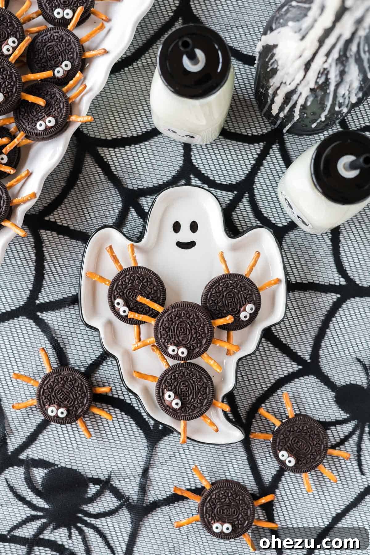 Spooky Oreo Spiders 3 Several Oreo spider cookies arranged on a white ghost-shaped plate for Halloween