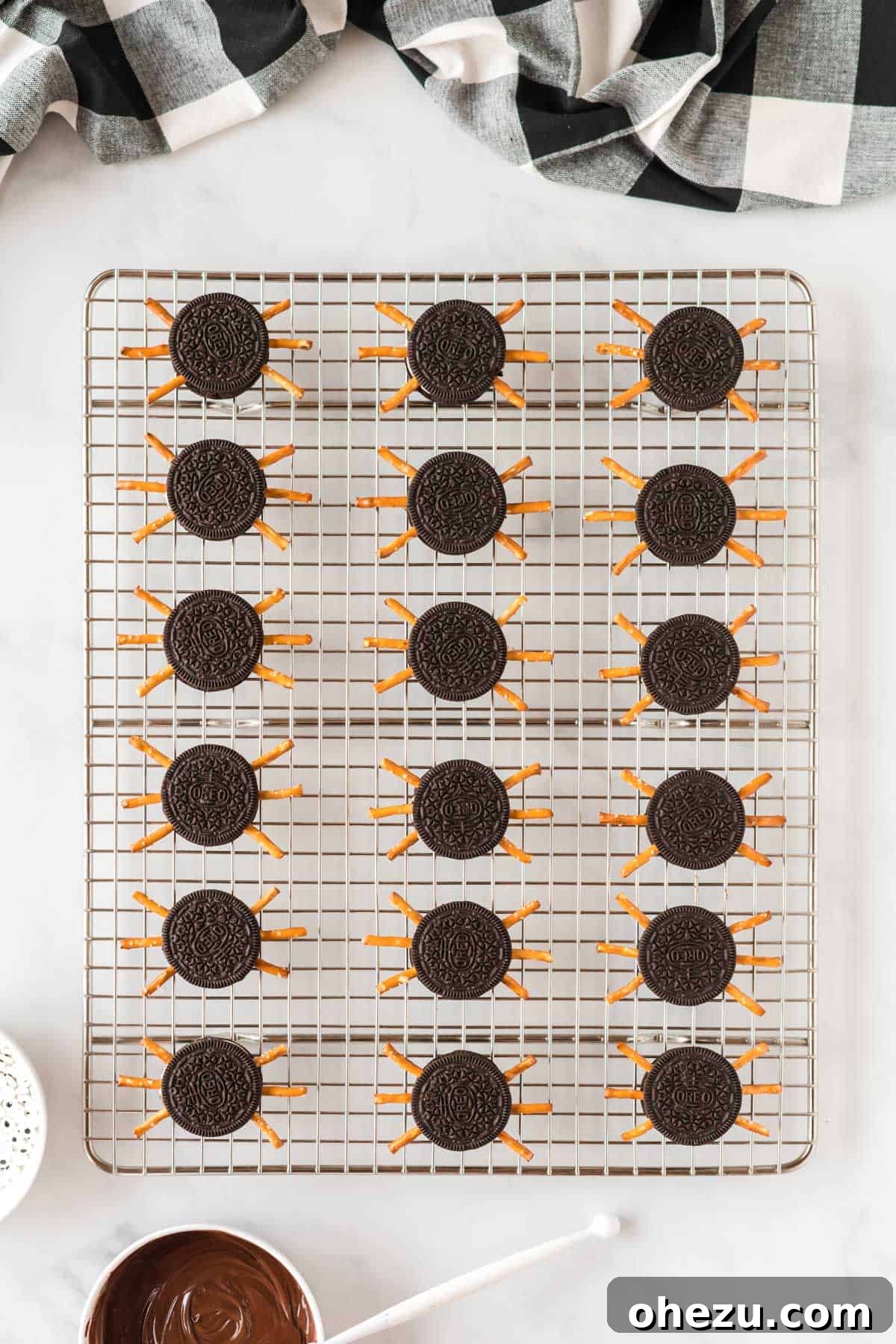 Spooky Oreo Spiders 8 Oreo cookies with pretzel legs already inserted, ready for eyes