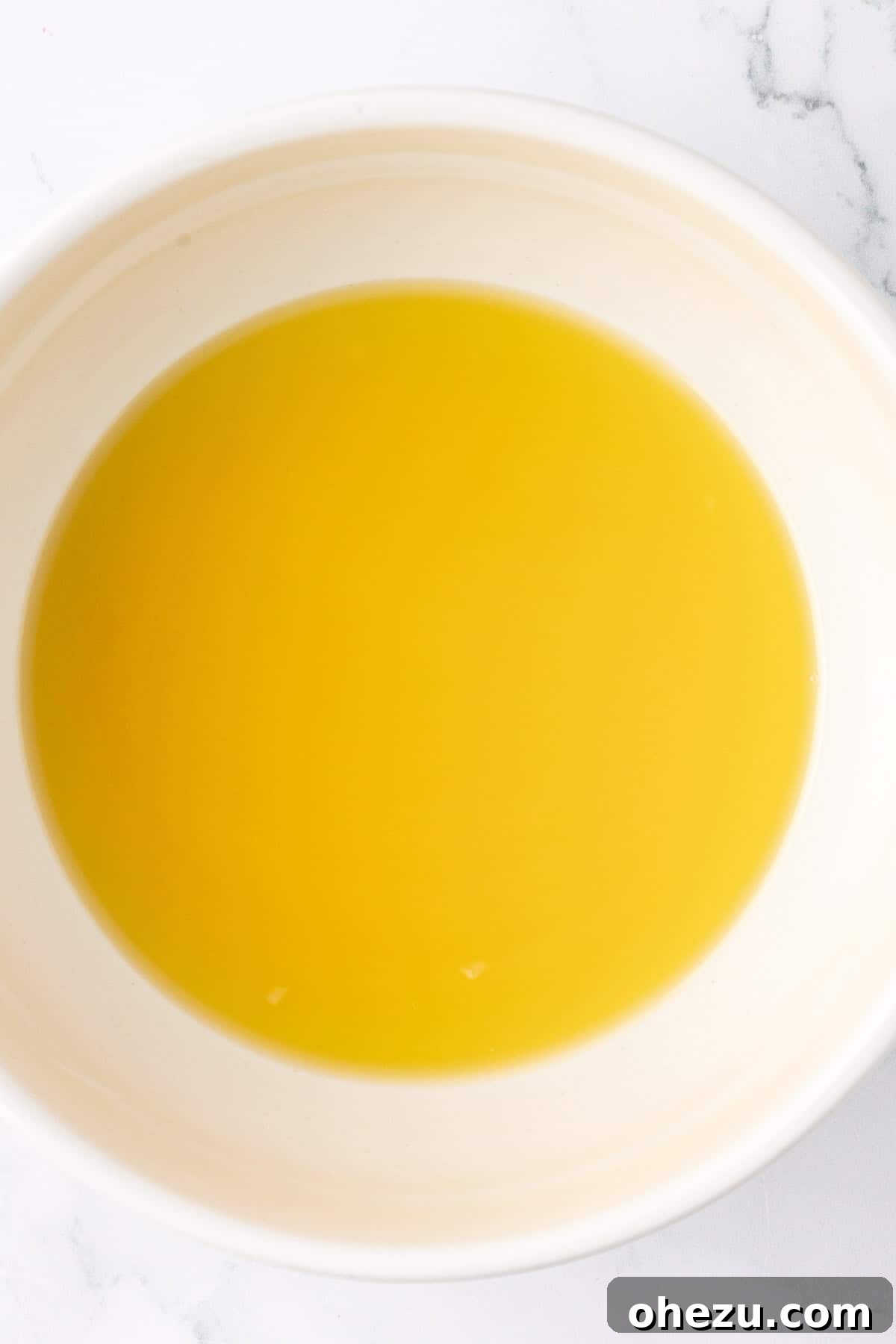 Melted vegan butter and coconut oil, ready to be mixed with dry ingredients.