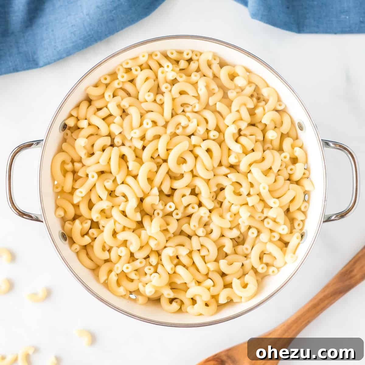 Tangy Greek Yogurt Mac and Cheese 5 cooked macaroni noodles in a strainer
