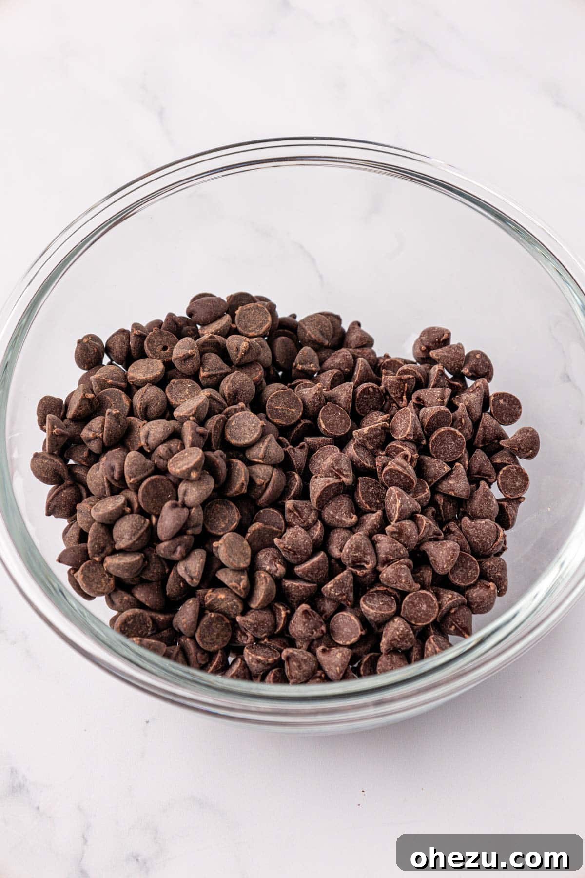 Chocolate chips in a mixing bowl, ready to be melted