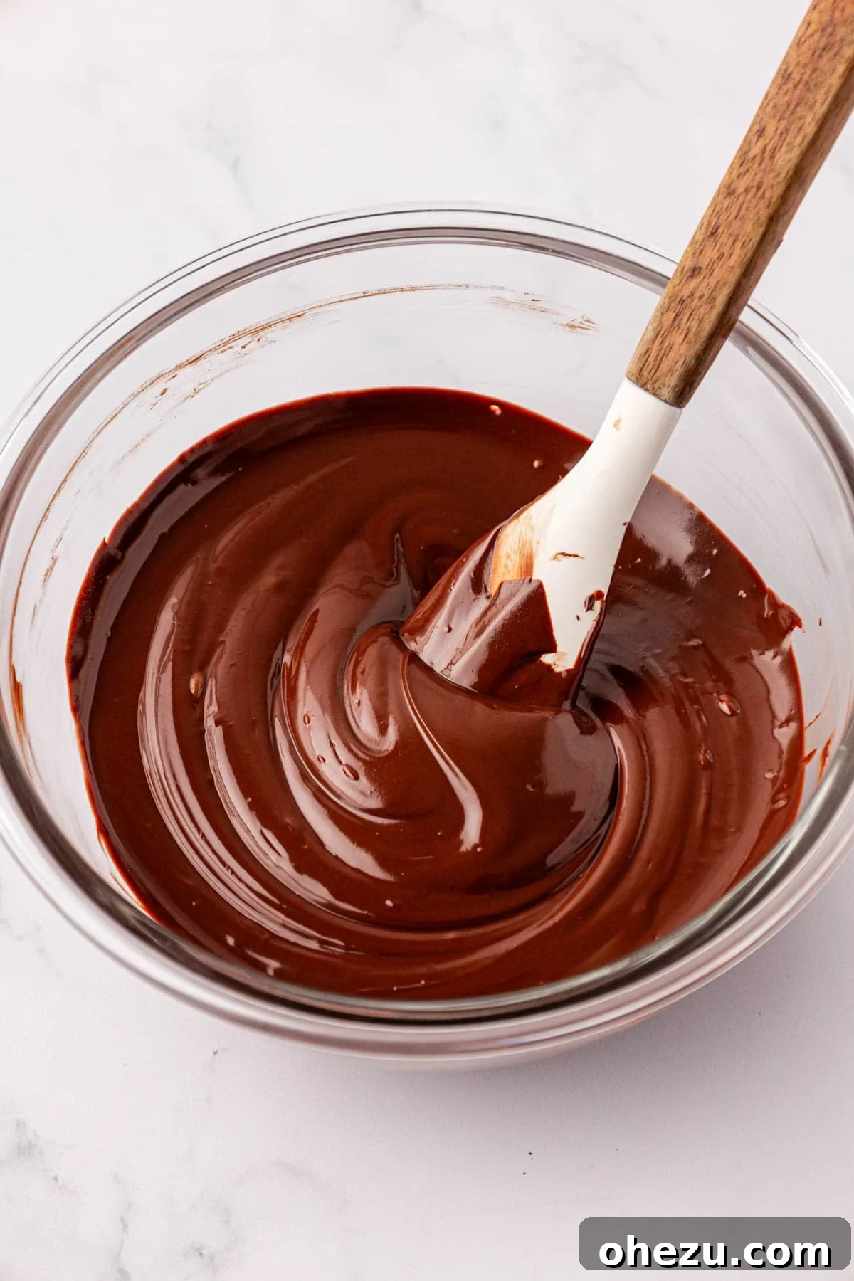 Smooth, melted chocolate in a mixing bowl
