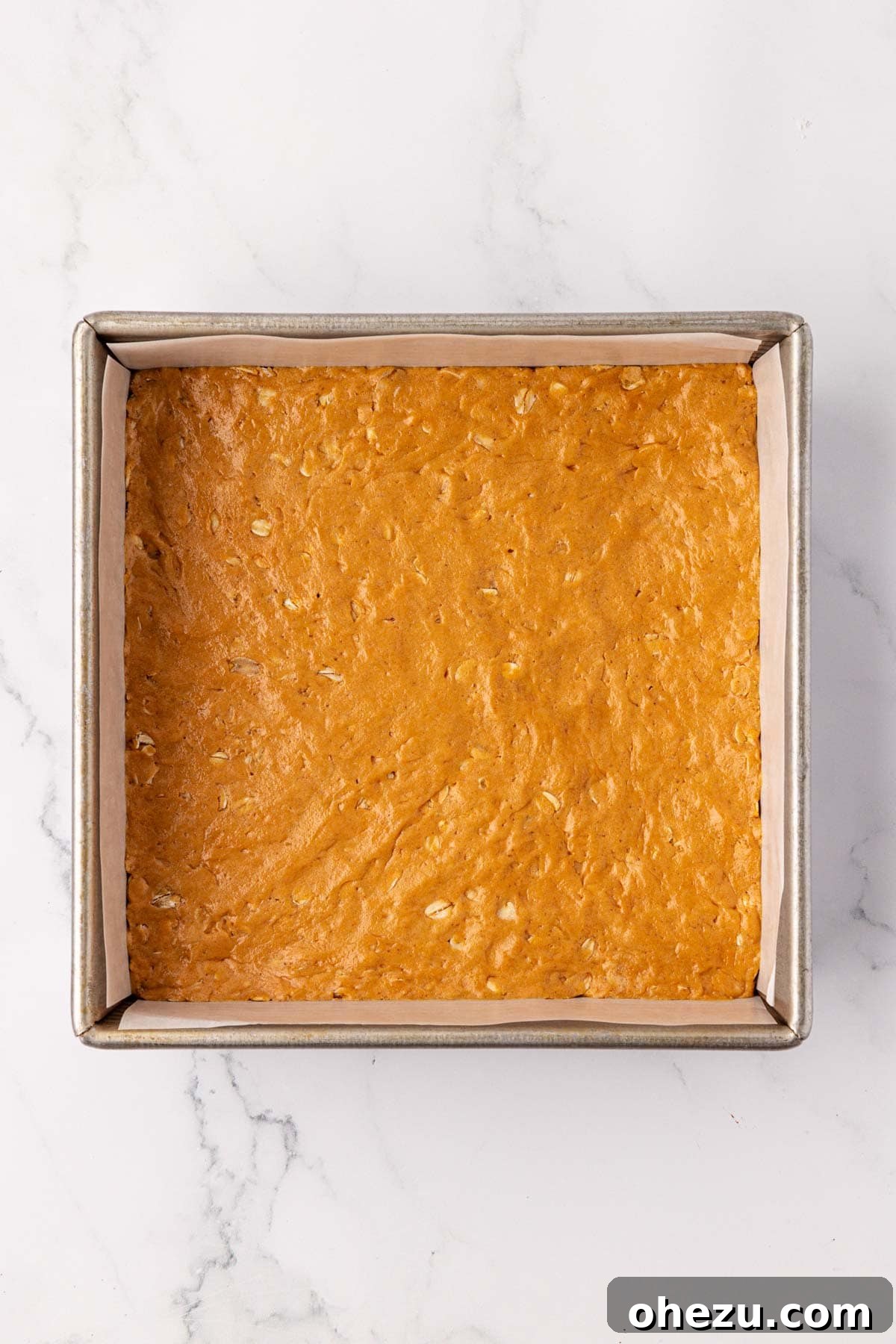 The protein bar batter pressed smoothly and evenly into the baking dish