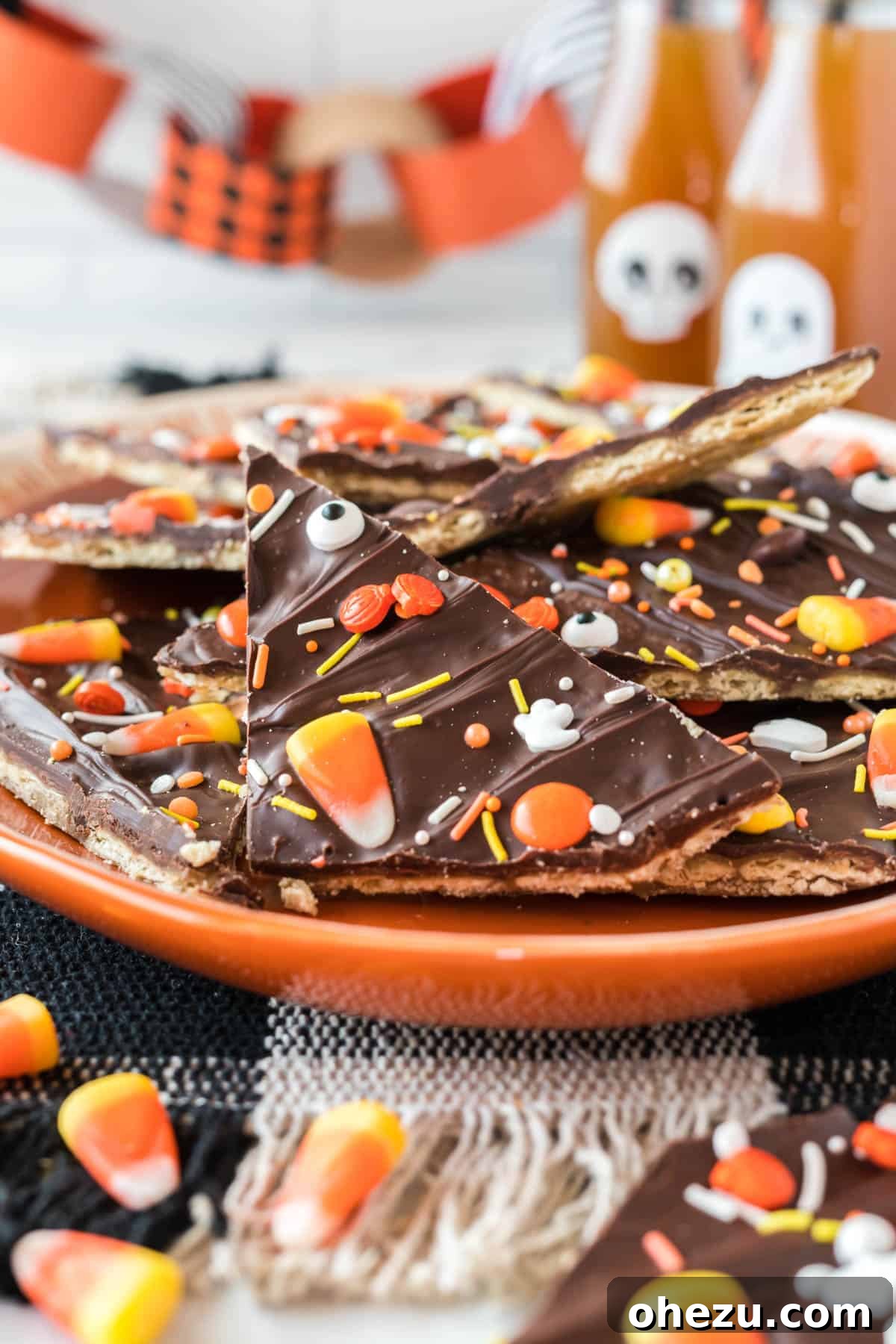 Another perspective of Halloween crack candy arranged on a festive orange plate, highlighting its aesthetic appeal for parties.