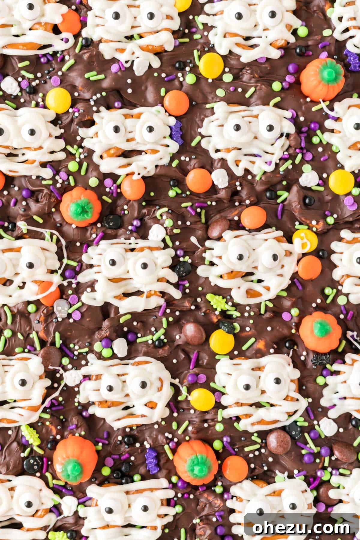 Halloween mummy bark featuring pretzel mummies with candy eyes