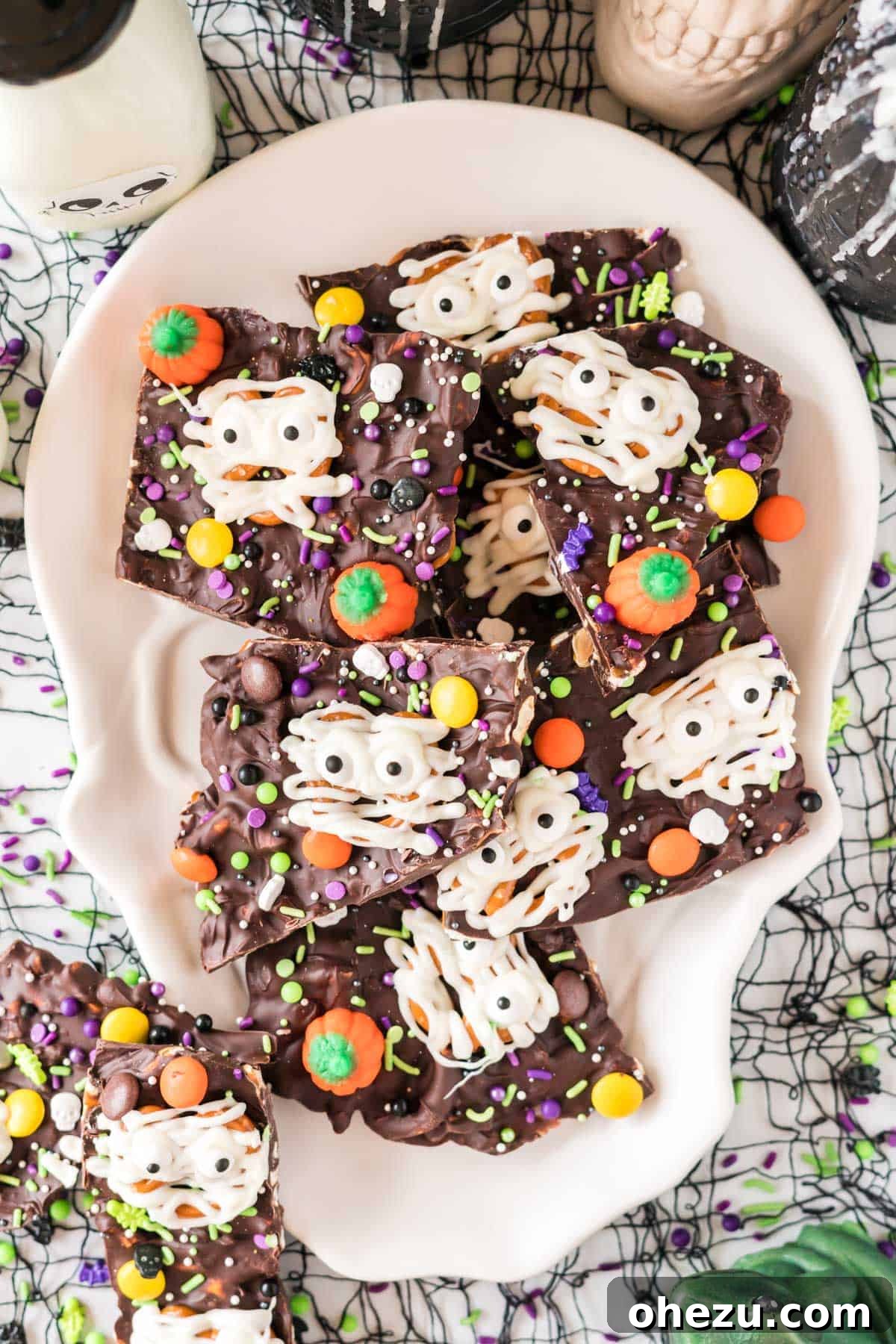 Halloween bark pieces served on a skull-shaped dish