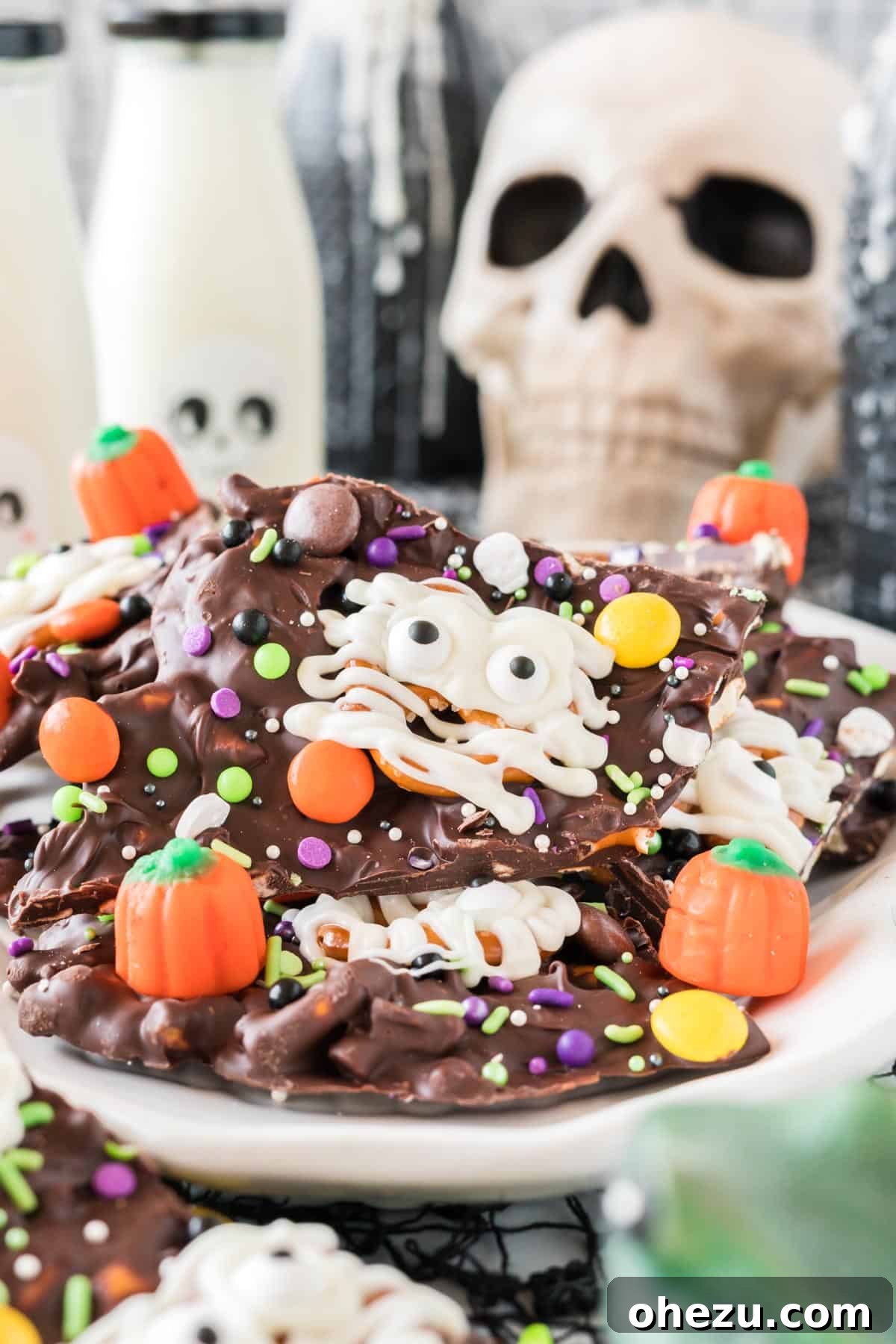 Another view of Halloween bark served on a skull dish, highlighting the decorations