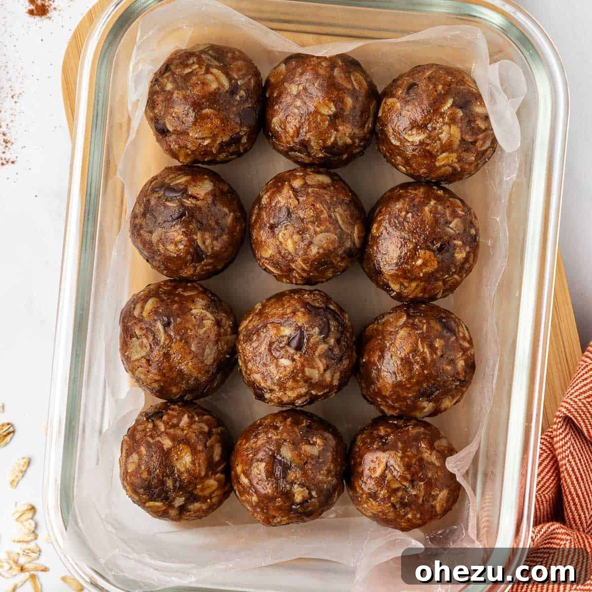A close-up shot of a single pumpkin protein ball, highlighting its rich color and inviting texture.