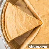 A close-up of a slice of no-bake pumpkin pie with its creamy texture.