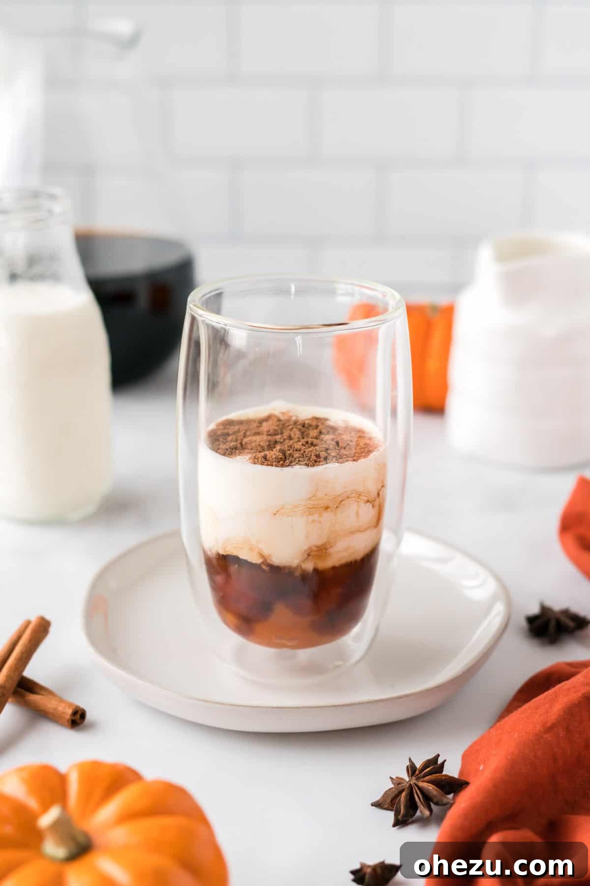 Spiced Pumpkin Cold Brew 4 All pumpkin cream cold foam ingredients – heavy cream, milk, pumpkin, maple syrup, pumpkin pie spice, and vanilla extract – measured and combined in a clear mixing cup, ready for frothing.