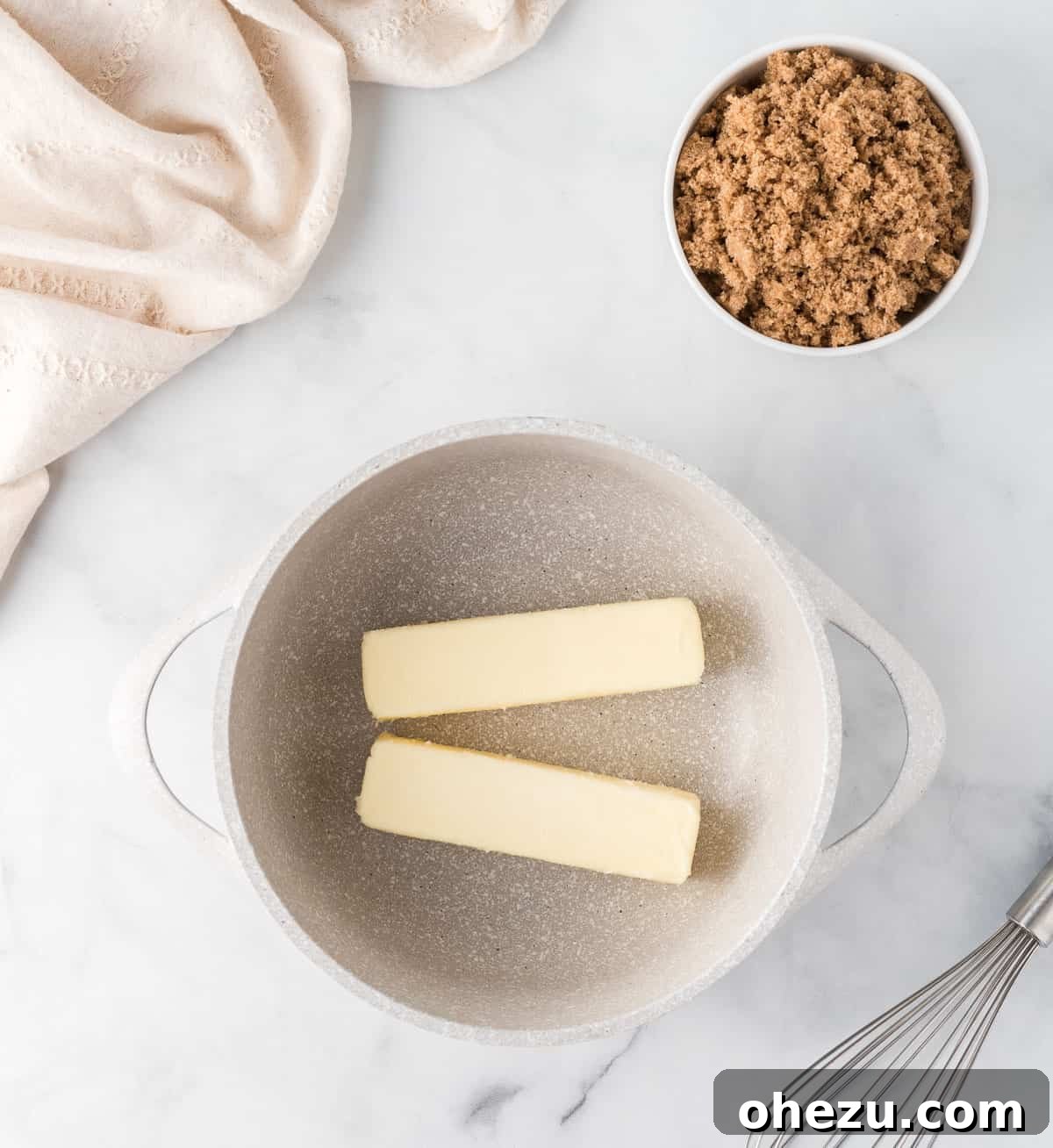 Two sticks of golden butter and a measure of dark brown sugar elegantly placed in a saucepan, slowly beginning to melt and combine into a promising mixture.