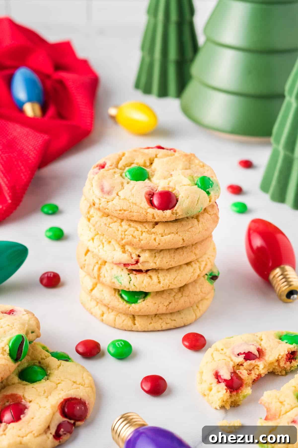 Holiday Cookie Magic from a Box 11 A stack of beautiful cake mix Christmas cookies surrounded by holiday decorations, ready to be enjoyed.