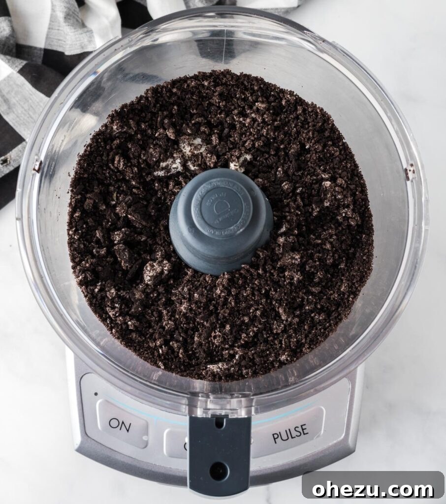Cookies and Cream Puppy Chow 6 Finely ground Oreo dust in a food processor, ready for the muddy buddies recipe.