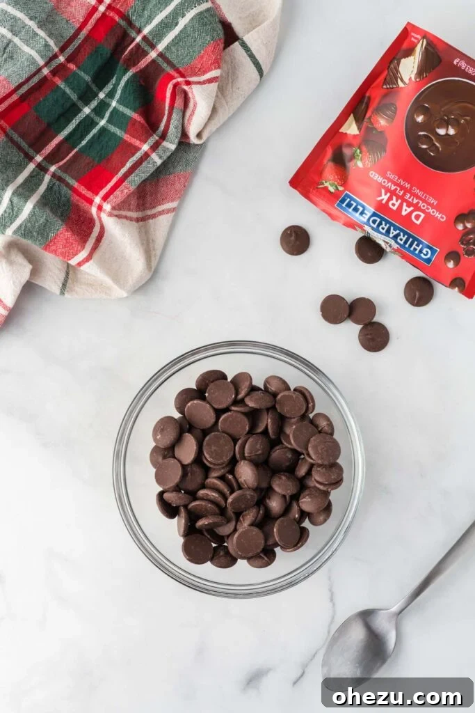 Decadent Holiday Oreo Treats 11 Dark chocolate melting wafers in a bowl, ready to be melted