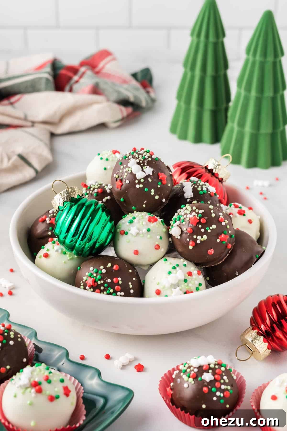 Decadent Holiday Oreo Treats 16 A festive bowl of Christmas Oreo balls, adorned with holiday decorations and ready for serving