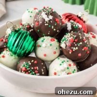 Decadent Holiday Oreo Treats 21 Christmas oreo balls in a bowl with holiday decorations