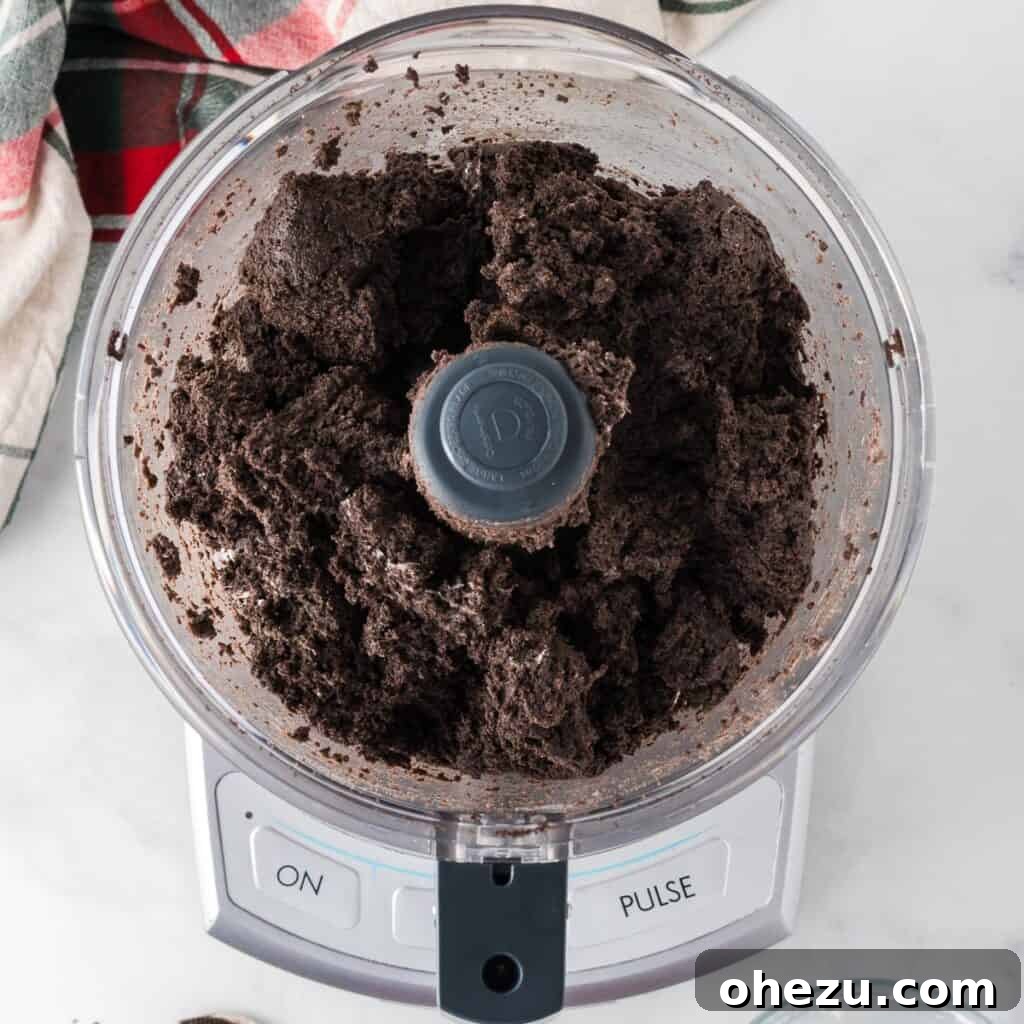 Decadent Holiday Oreo Treats 8 The mixture of crushed Oreos and cream cheese blended together in the food processor
