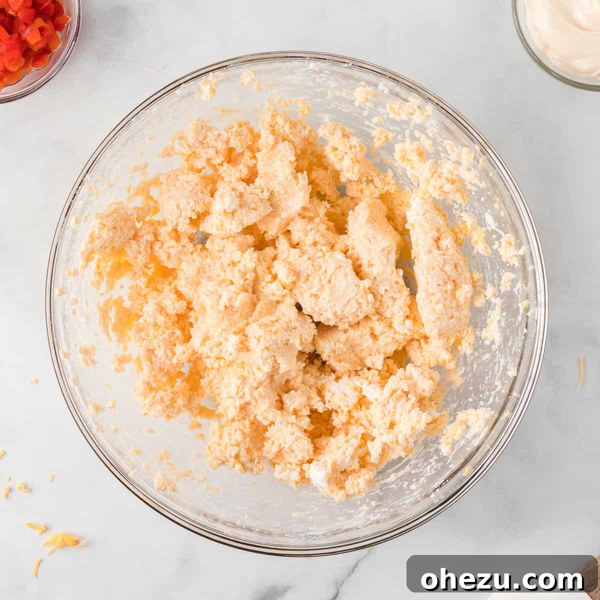 cream cheese and cheddar cheese thoroughly mixed into a smooth, cohesive base