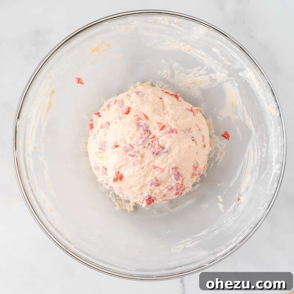 pimento cheese ball mixture expertly formed into a perfect round shape