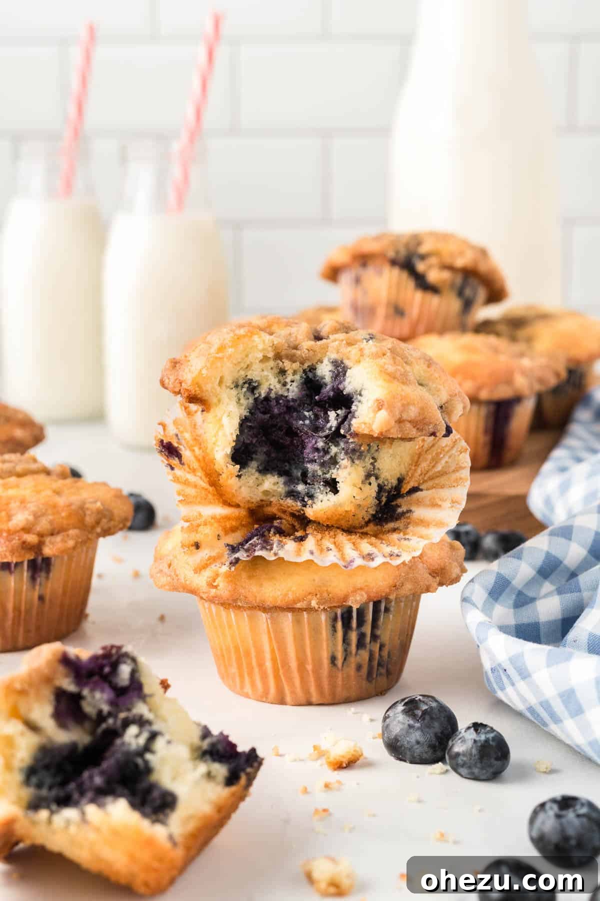 A close-up shot of a warm, inviting cake mix blueberry muffin with its streusel topping, ready to be enjoyed
