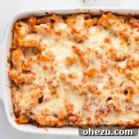 Delicious vegetarian baked ziti in a casserole dish, ready to be enjoyed.