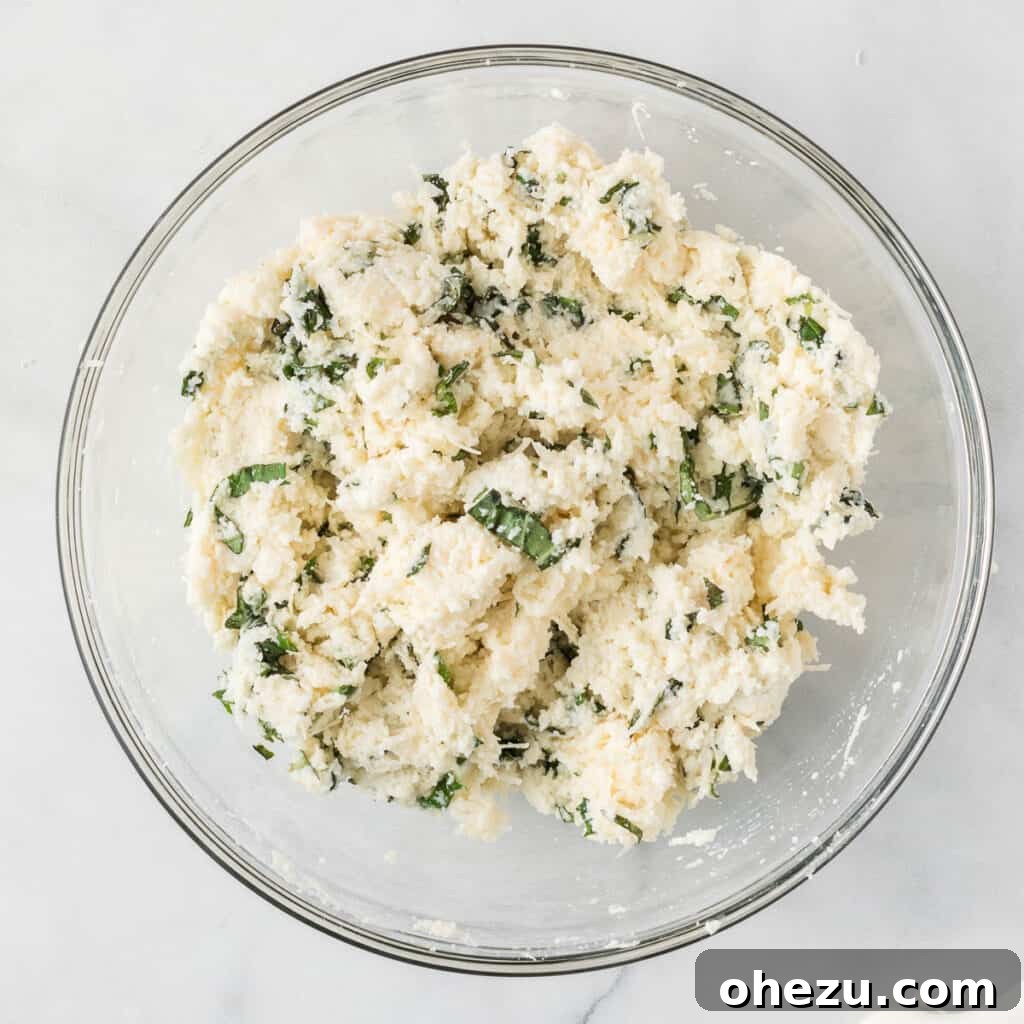 The ricotta cheese mixture, perfectly combined with fresh basil and parmesan, creating a rich and fragrant filling.