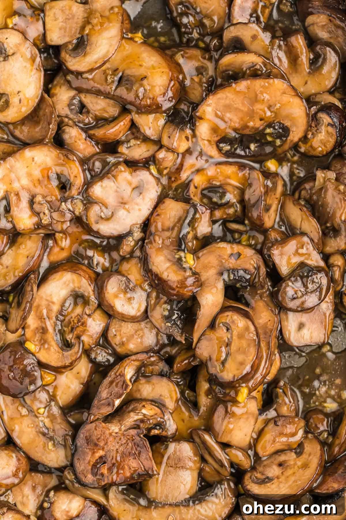 A close-up shot of the finished teriyaki mushrooms, glossy with sauce, garnished and perfectly ready to be savored.