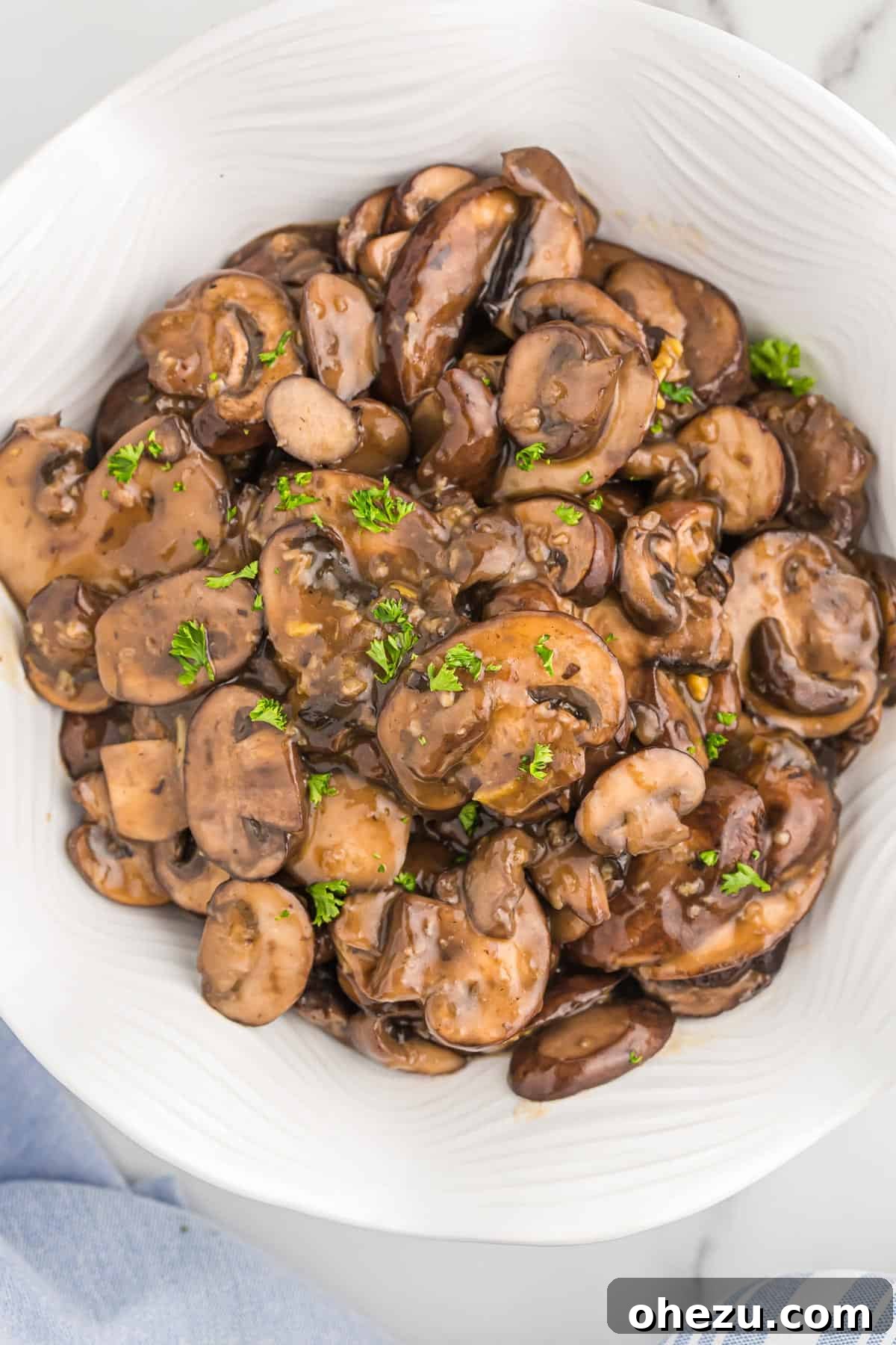 Beautifully glazed teriyaki mushrooms artfully arranged in a clean serving bowl, ready to be enjoyed as part of a meal.