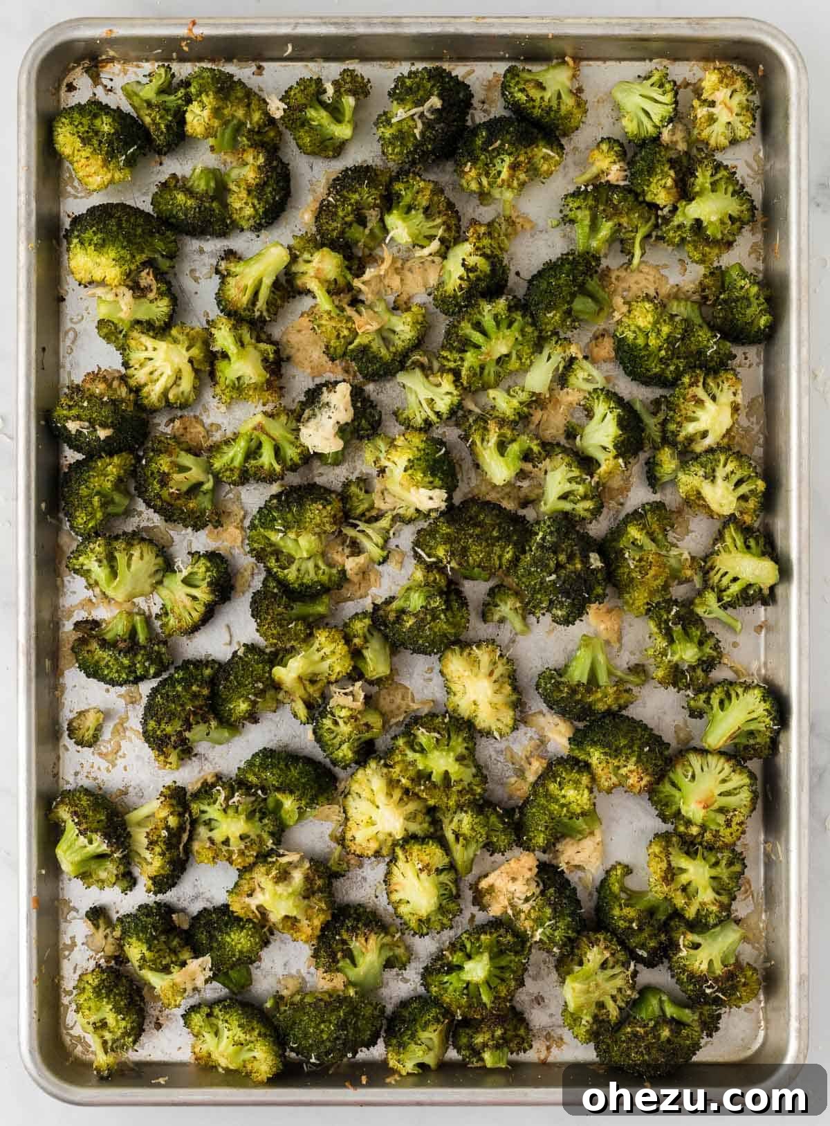 Crispy Parmesan Roasted Broccoli 11 A rustic white bowl overflowing with freshly roasted broccoli with parmesan, garnished and ready to be enjoyed