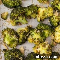 Crispy Parmesan Roasted Broccoli 14 A small serving of roasted broccoli with parmesan on a sheet pan, ready to be presented