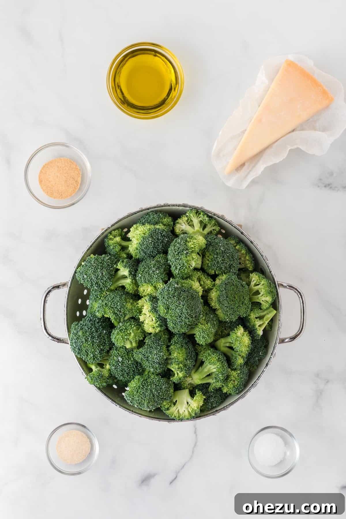 Crispy Parmesan Roasted Broccoli 3 All the ingredients needed for easy roasted broccoli: fresh broccoli florets, olive oil, salt, garlic powder, onion powder, and a wedge of parmesan cheese