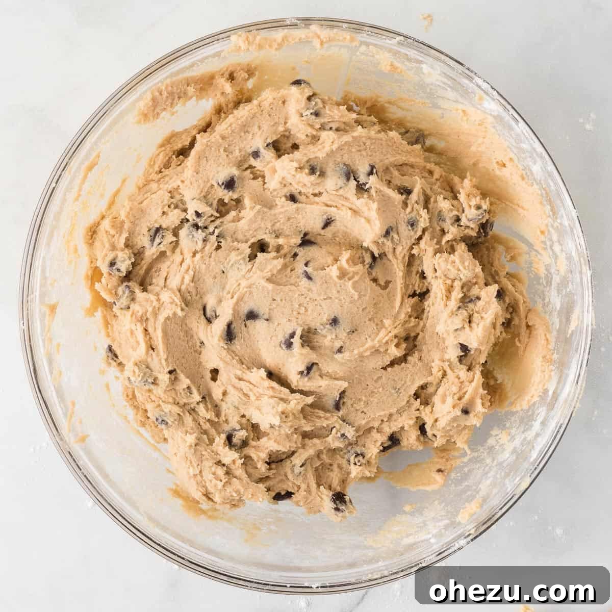 Decadent Dairy-Free Chocolate Chip Cookies 11 Dairy-free chocolate chip cookie dough chilling in a bowl