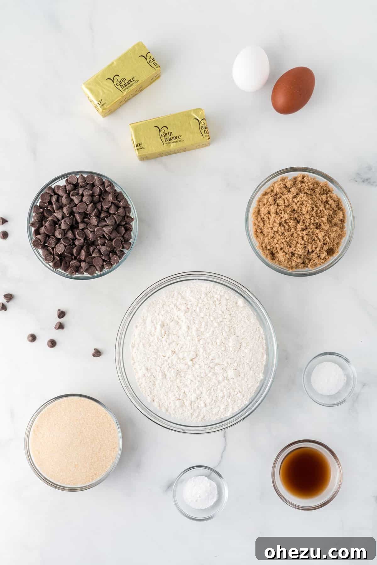 Decadent Dairy-Free Chocolate Chip Cookies 4 Dairy-free chocolate chip cookie ingredients laid out on a counter