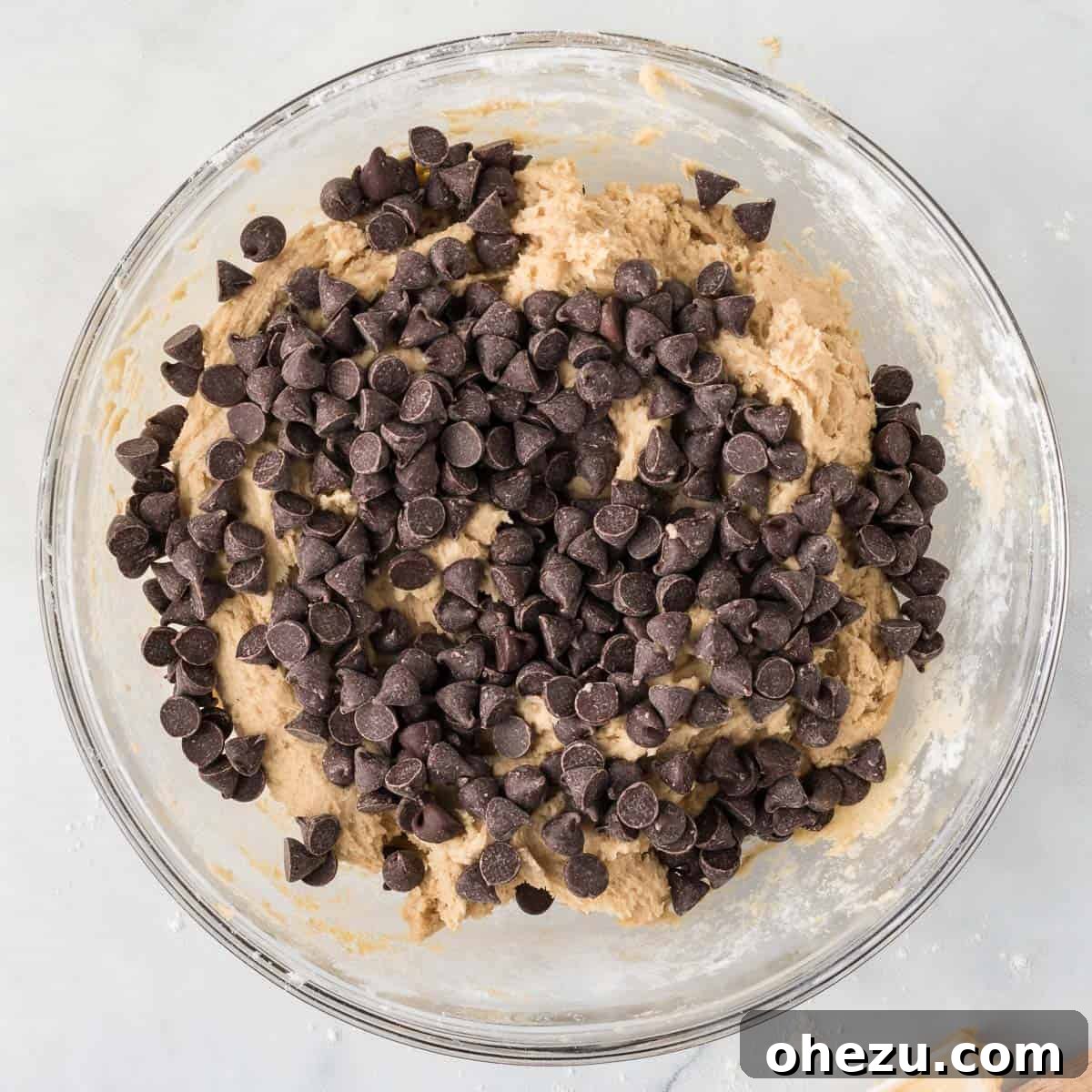 Decadent Dairy-Free Chocolate Chip Cookies 10 Folding dairy-free chocolate chips into cookie dough