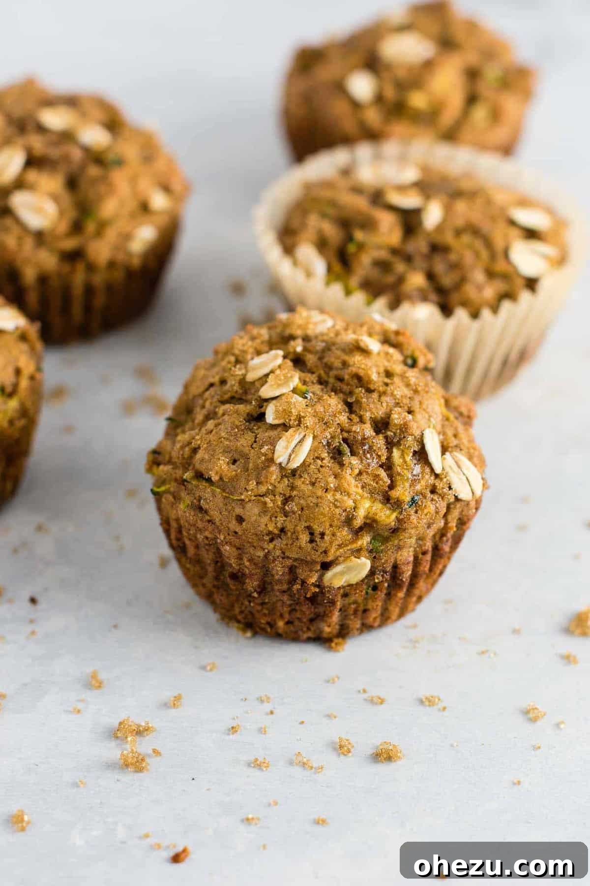 Delicious healthy zucchini bread muffins with brown sugar topping, perfect for breakfast or a snack.