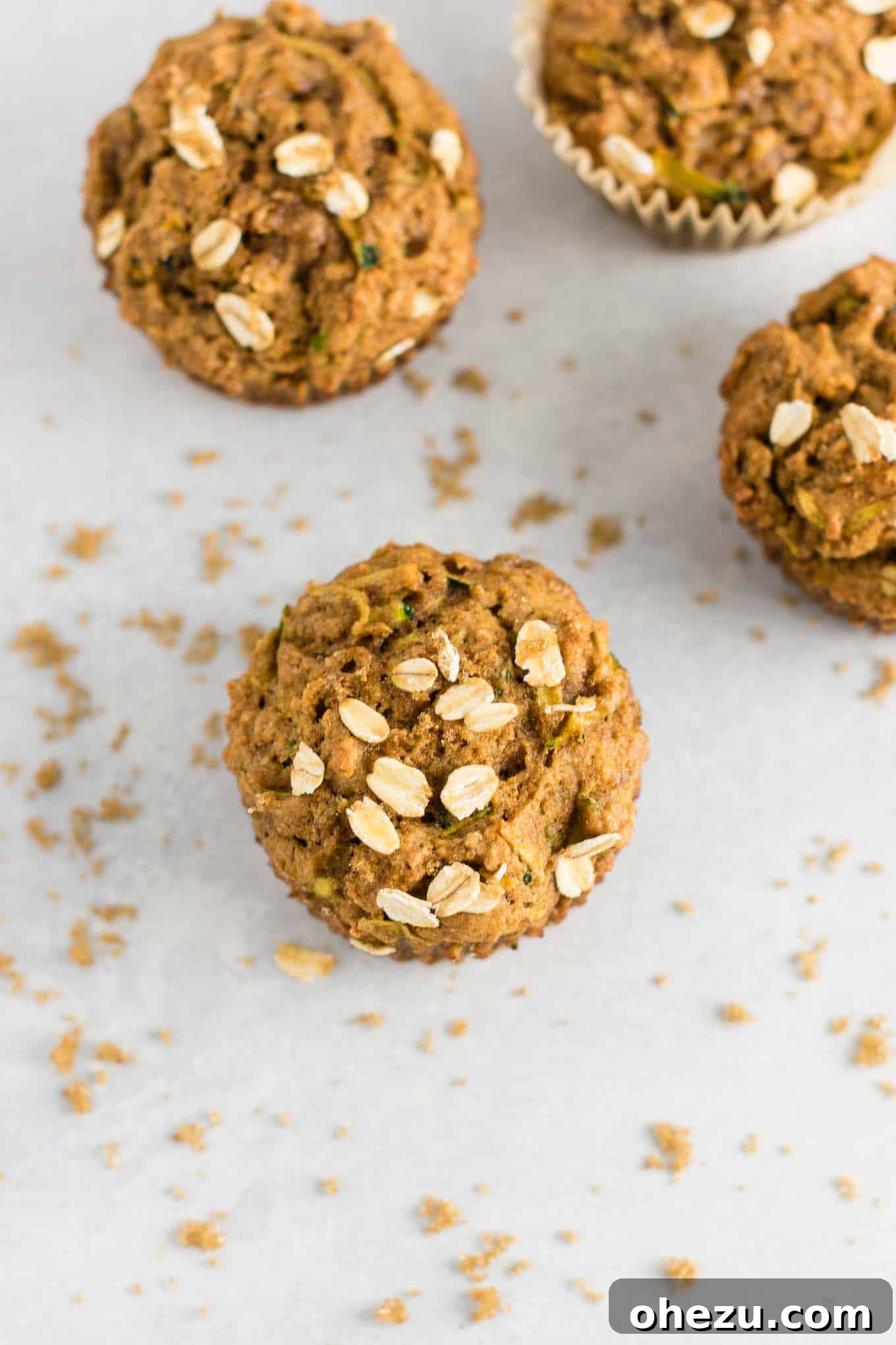 A plate of freshly baked brown sugar zucchini bread muffins, ready to be enjoyed.