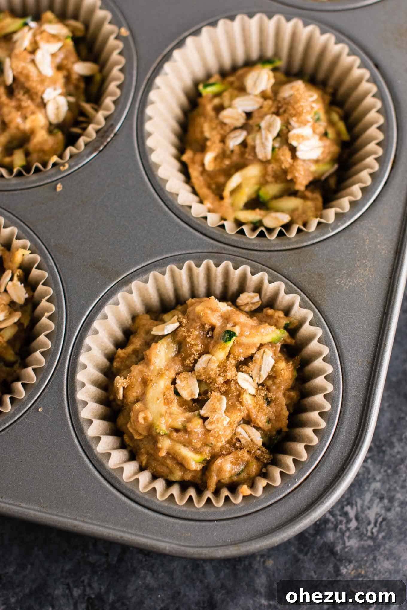 Freshly grated zucchini, a key ingredient for moist and healthy muffins.