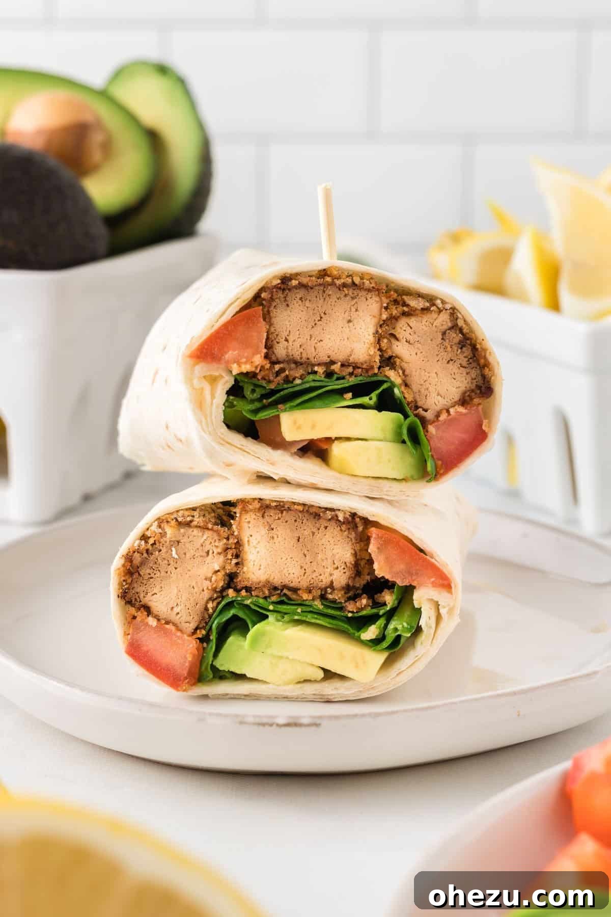 Vibrant Tofu Wraps 2 Stacked tofu wraps on a plate, showcasing a delicious vegetarian meal.