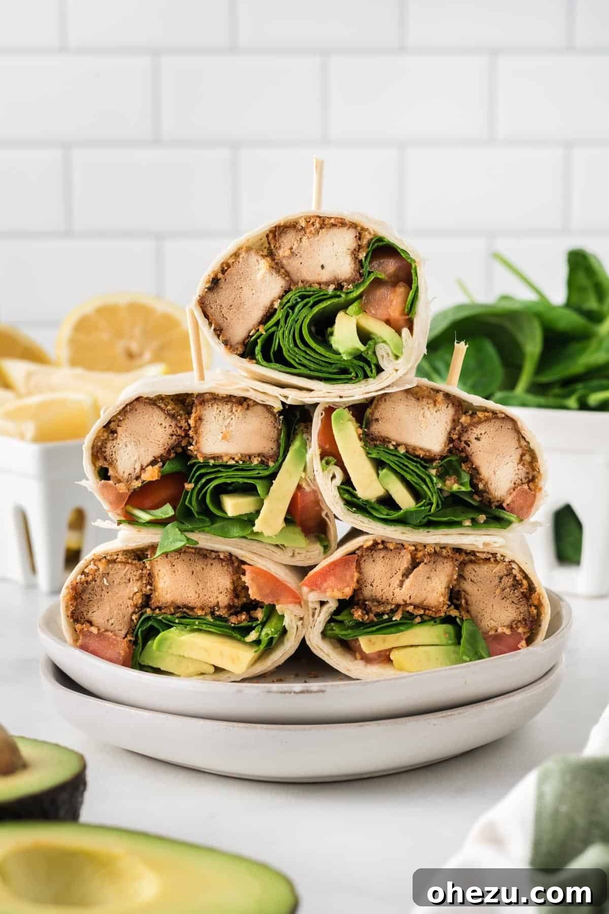 Vibrant Tofu Wraps 19 A striking overhead shot of several perfectly stacked tofu wraps on a white plate, ready to be served.