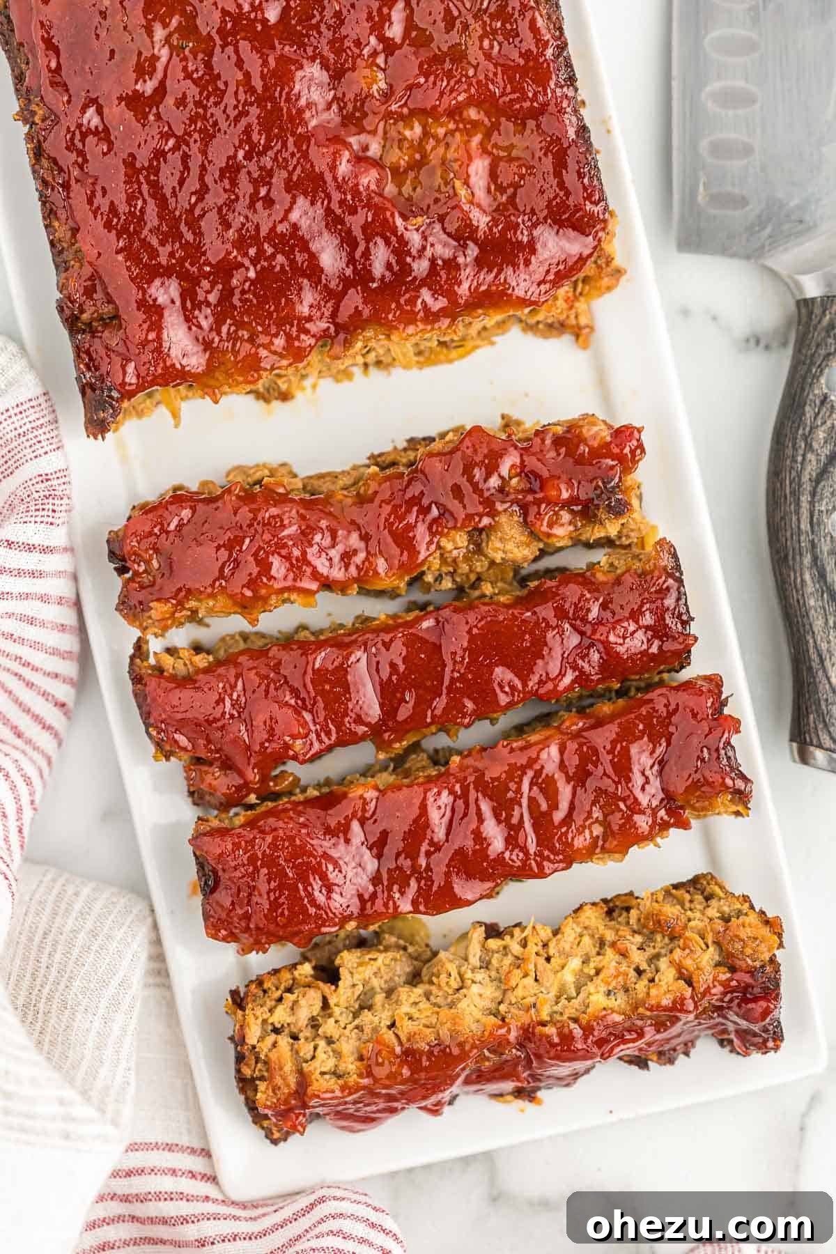 Meatless Meatloaf Marvel 4 Perfectly sliced vegetarian meatloaf, showcasing its moist texture and rich, savory interior, ready to be served and enjoyed.