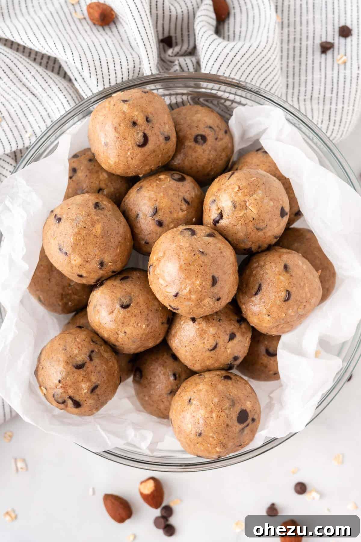 Wholesome Almond Butter Protein Bites 2 Almond butter protein balls stacked invitingly in a rustic bowl, ready to be enjoyed as a healthy snack.