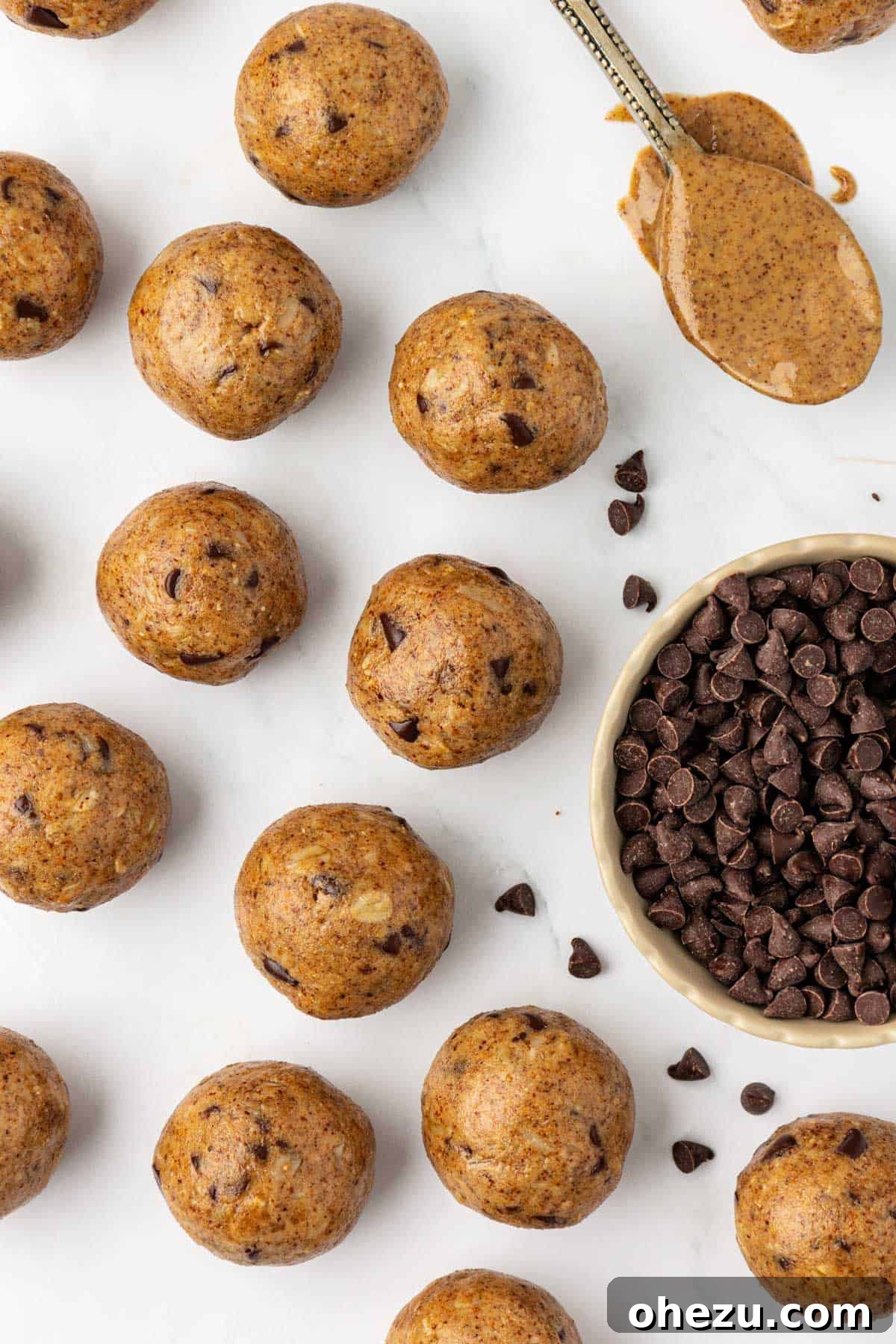 Wholesome Almond Butter Protein Bites 3 Close-up of a stack of fluffy almond butter protein balls, showing their inviting texture and rich color, promising a delicious bite.