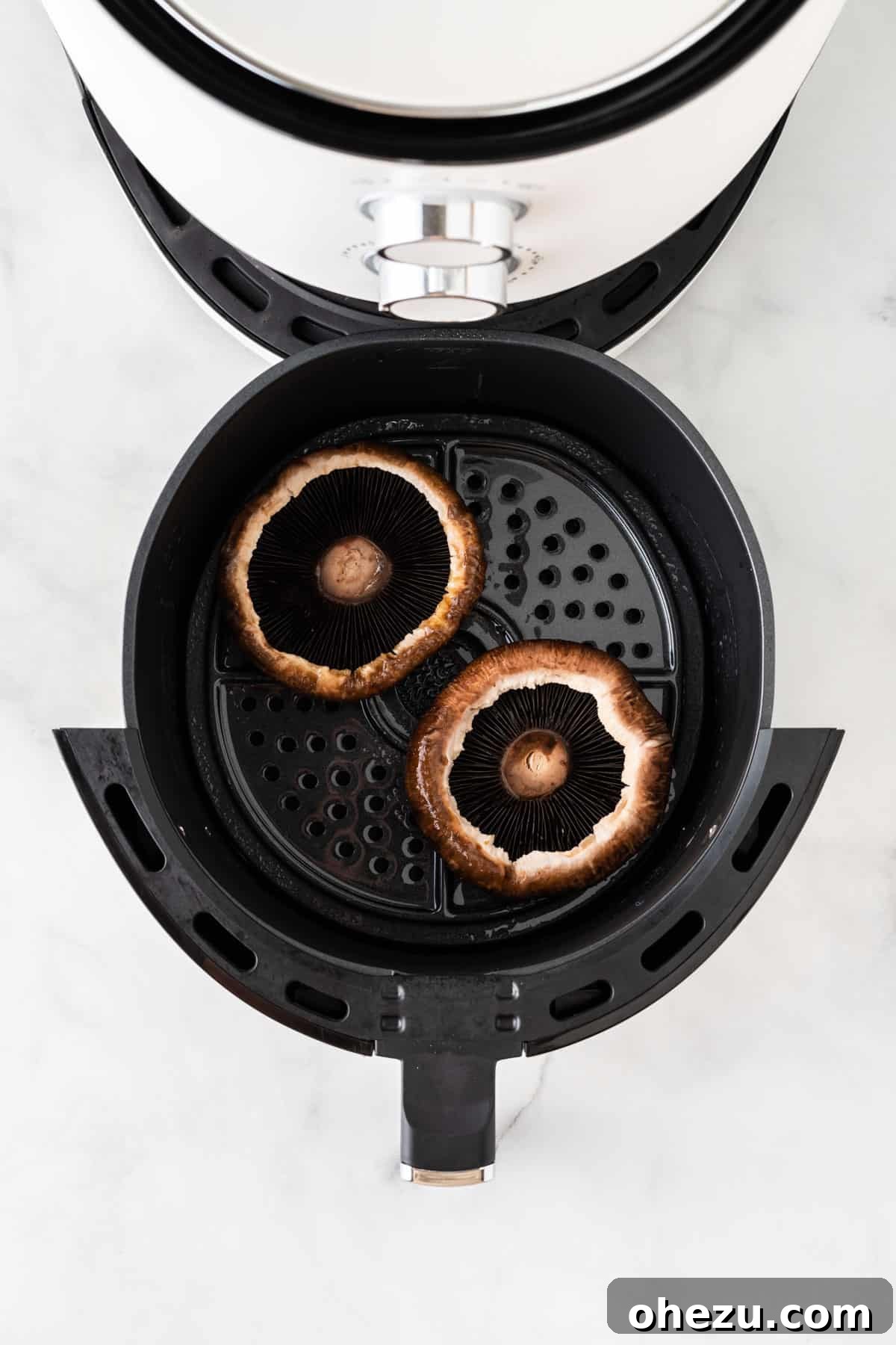 Perfect Air Fryer Portobello 6 adding the portobello mushrooms to the air fryer
