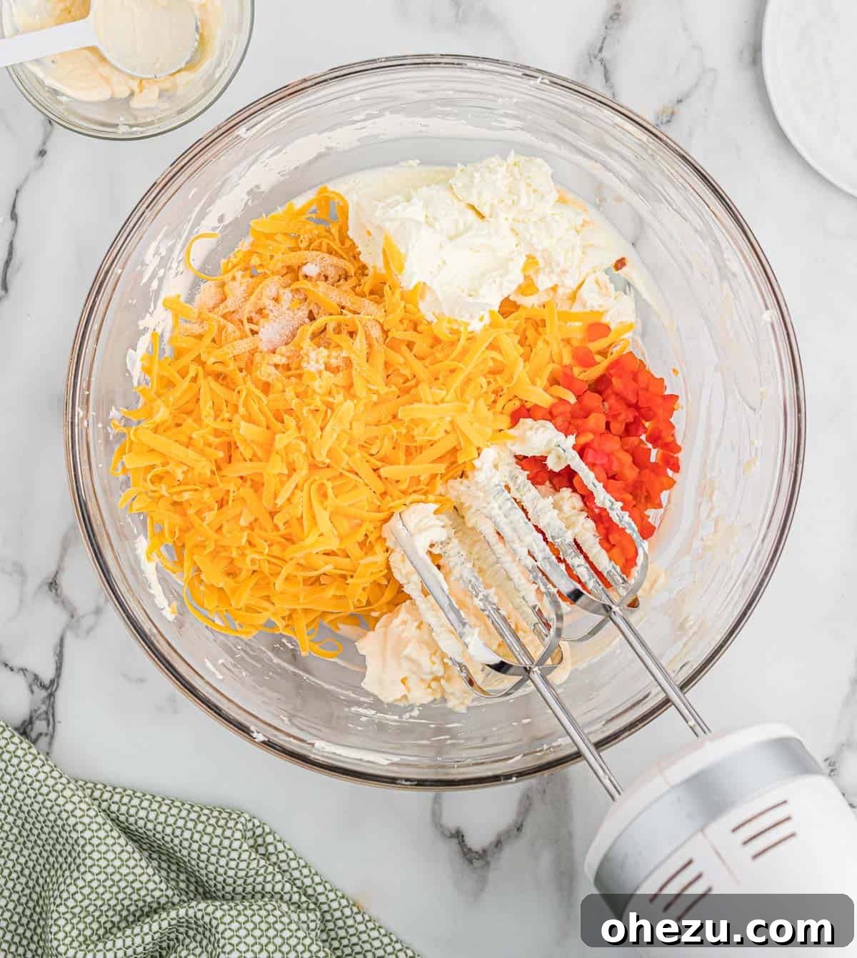 adding the remaining ingredients to the cream cheese