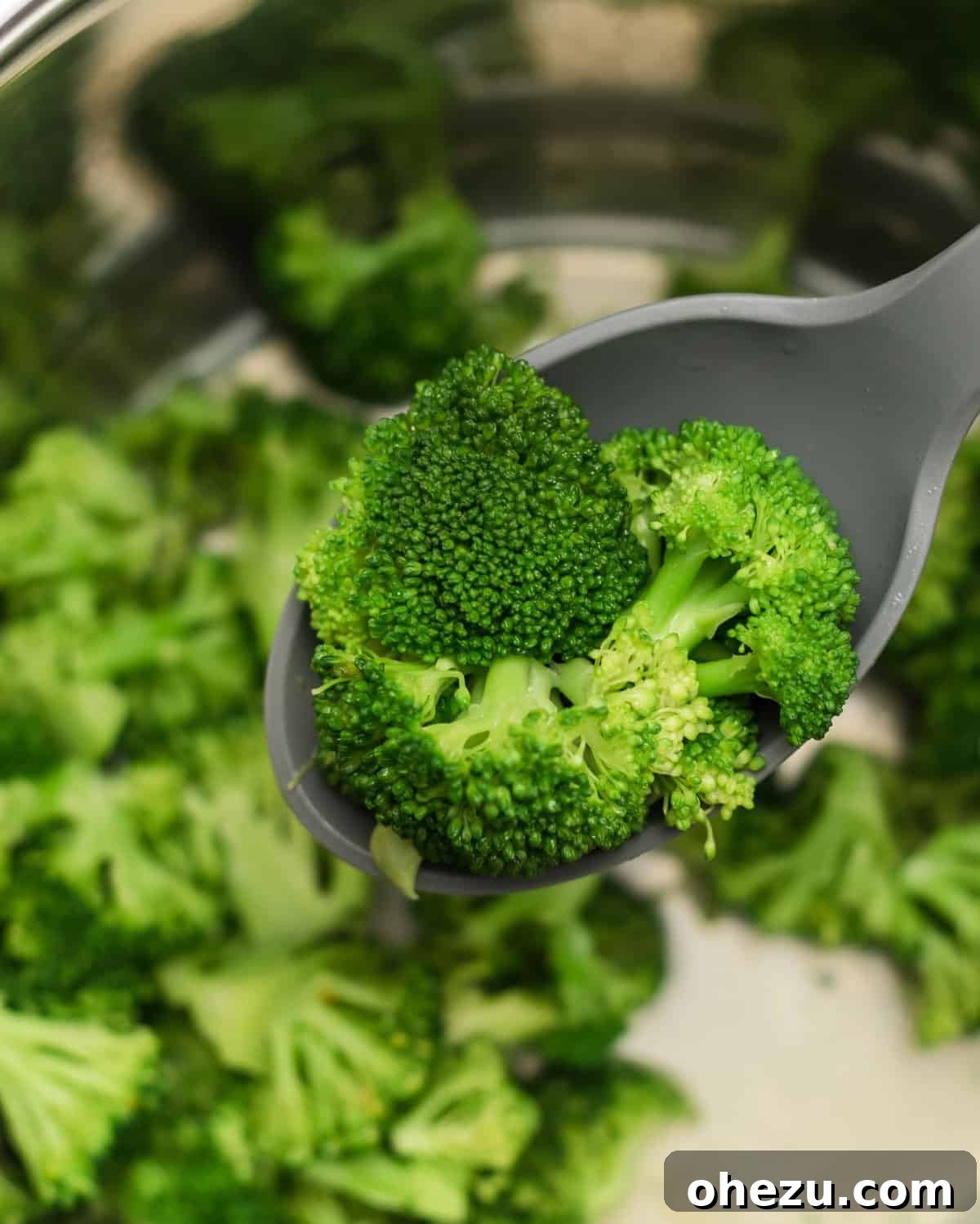 Effortless Instant Pot Broccoli 6 Close-up of fluffy, steamed broccoli in the Instant Pot, glistening with melted butter