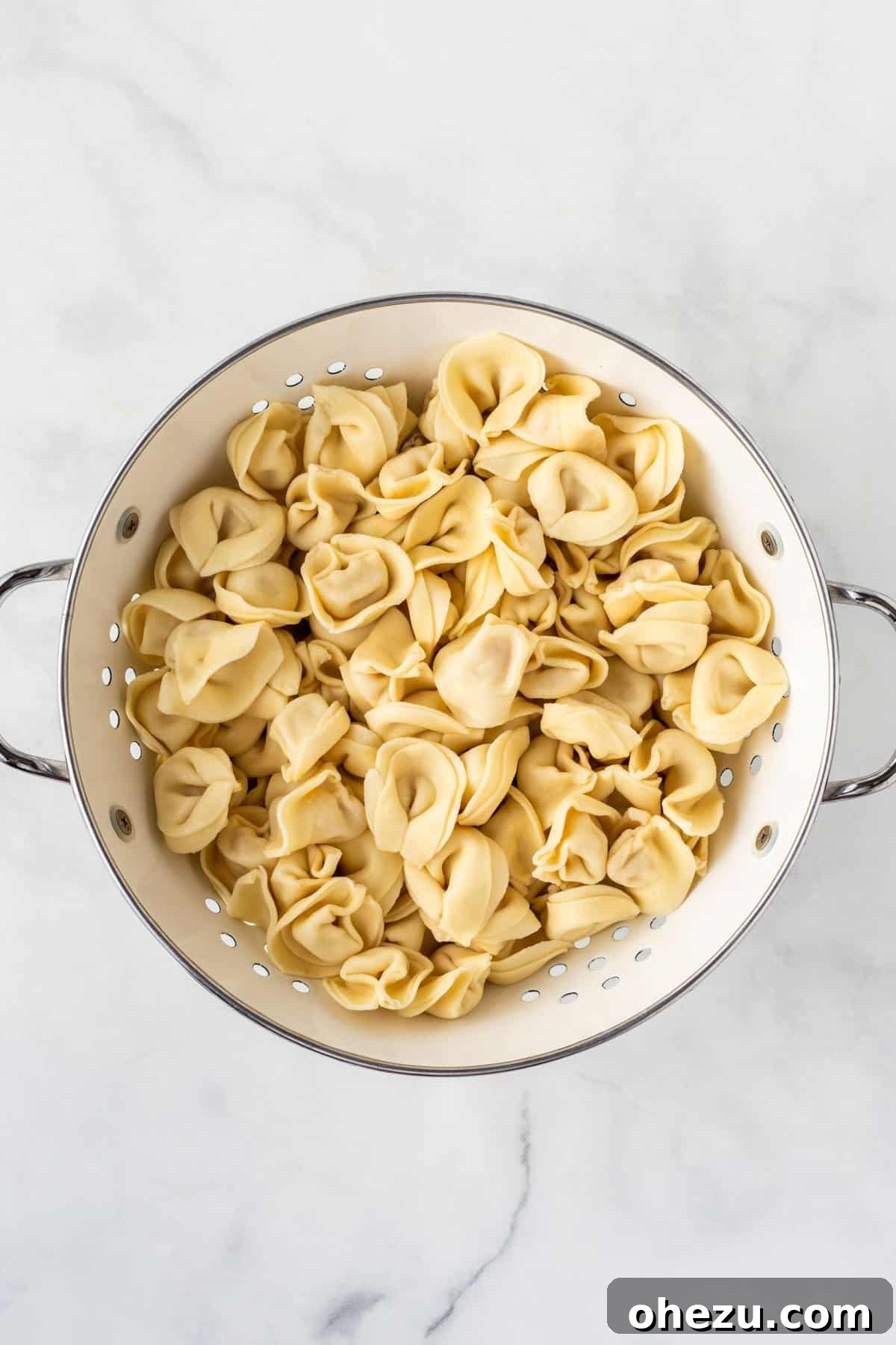 Flavorful Tortellini Pasta Salad 5 cooked tortellini in a collander