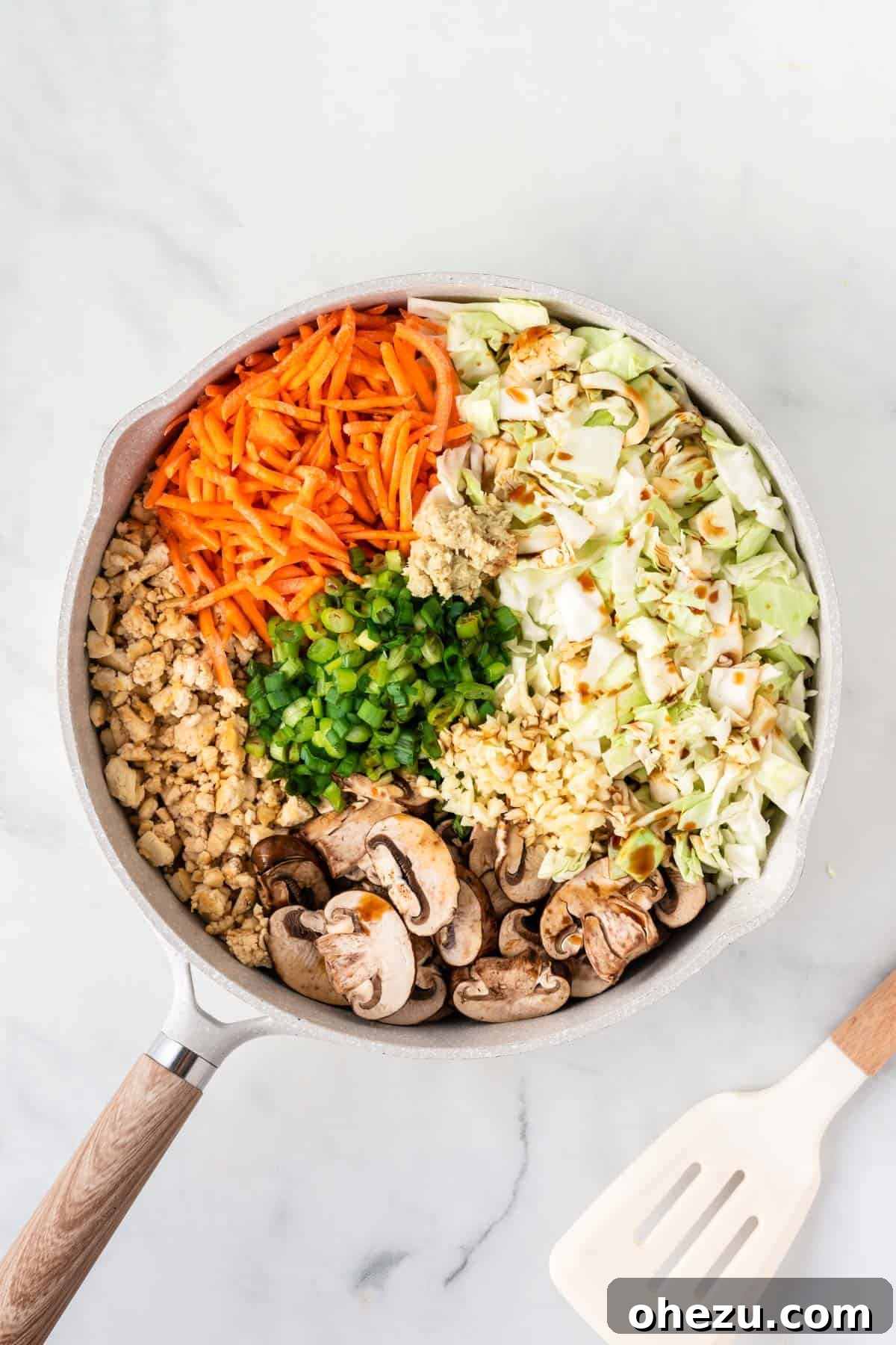 adding the rest of the veggies to the skillet