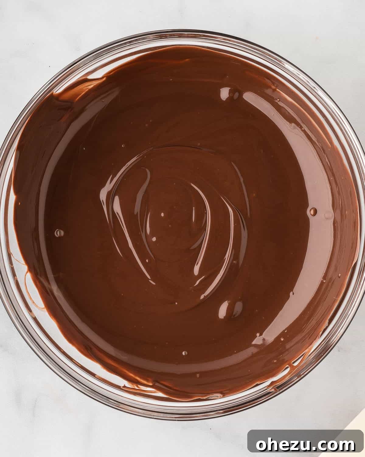 Wicked Oreo Truffles 11 Smooth, melted dark chocolate wafers in a bowl